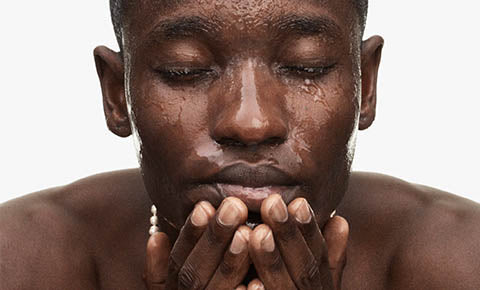 Man washing his face. Man washing his face.