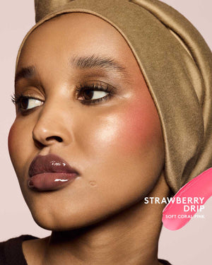 medium skin toned model wearing cheeks out freestyle cream blush in shade strawberry drip