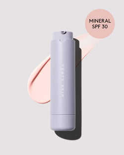 Bottle of Mineral Hydra Vizor Invisible Moisturizer Broad Spectrum SPF 30 Sunscreen with Niacinamide + Kalahari Melon on a lilac backdrop. Bottle of Mineral Hydra Vizor Invisible Moisturizer Broad Spectrum SPF 30 Sunscreen with Niacinamide + Kalahari Melon on a lilac backdrop.