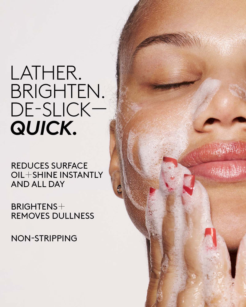 Model washing their face with Cherry Dub Gel Cleanser. Copy reads lather. brighten. de-slick quick. reduces surface oil shine instantly and all date, brightens + removed dullness, non stripping.
