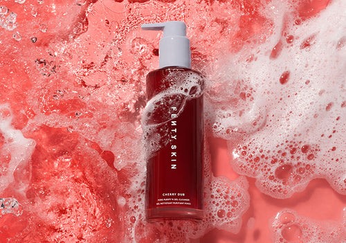 Cherry Dub Por Purify Gel Cleanser on a red foamy background. Cherry Dub Por Purify Gel Cleanser on a red foamy background.