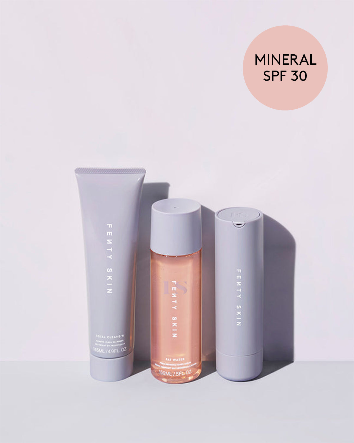 Bundle of Fenty Skin Start'r Set containing full-size versions of Total Cleans’r Face Cleanser, Fat Water Serum Toner, and Hydra Vizor Mineral Sunscreen.