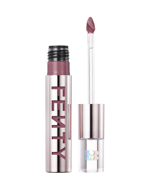 An open Fenty Icon Velvet lipstick tube on a light background. An open Fenty Icon Velvet lipstick tube on a light background.