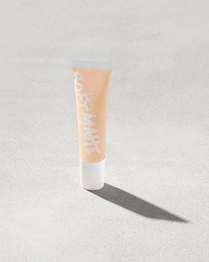 tube of Fenty Beauty Pro Filt'r Mini Soft Matte Longwear Foundation in shade #120 on concrete background