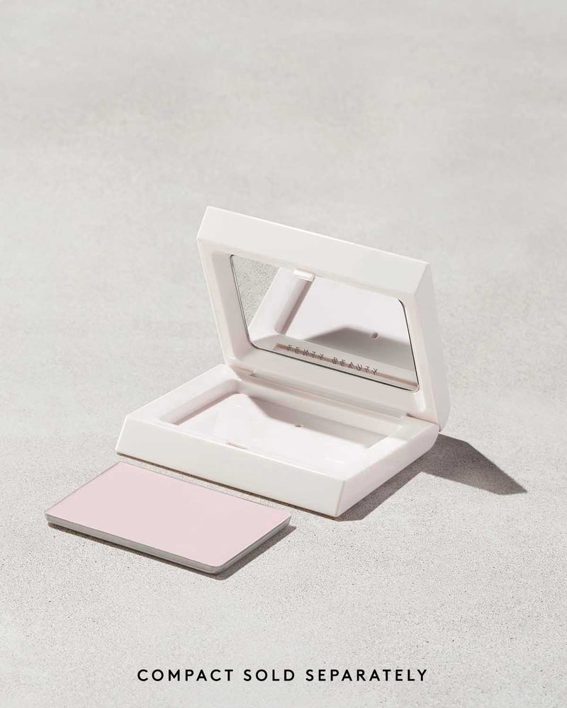 Open compact of the Invisimatte Setting Powder empty and its refill on a light background.