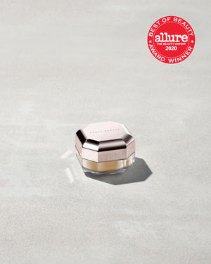 A jar of mini setting powder stood on a grey background