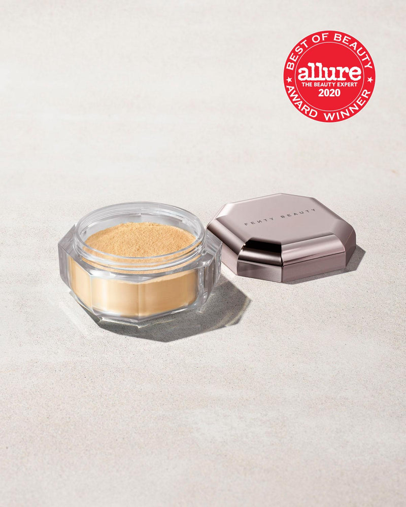 an open jar of mini setting powder, with the lid to one side, laid against a gray background and the Allure "Best of Beauty" award stamp overimposed