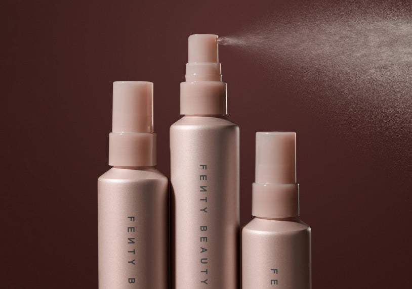 Product shot of 3 You Mist Makeup-Extending Setting Spray bottles. Middle bottle displays fine mist spray.