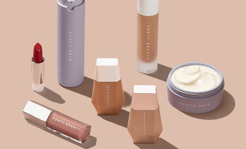 array of beauty and skincare products on a neutral background