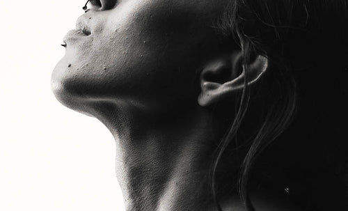 Black and white shot of model looking upwards