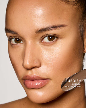 Medium skin tone model wearing suedish match stix contour.