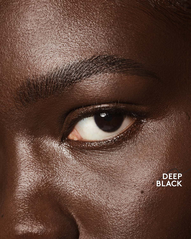 deep skin toned model wearing brow MVP in deep black