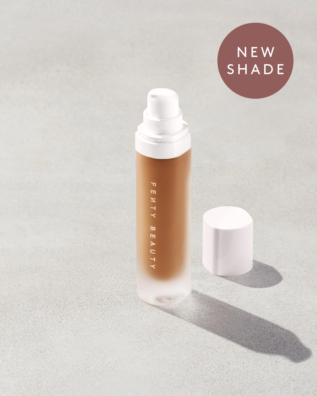 An open bottle of a new shade of Pro Filt'r Soft Matte Longwear Foundation in the shade 425 on a grey background.