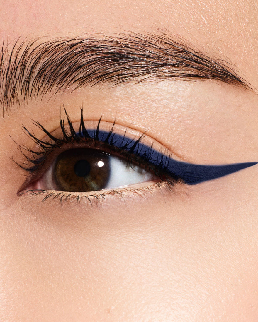 Macro of model wearing Fine Linez Lash-Enhancing Eyeliner in shade 'The Navy'.