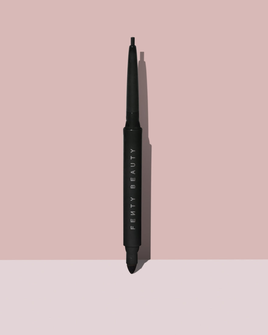 Fine Linez Lash Line-Enhancing Eyeliner in shade 'Cuz I'm Black' open capped product shot on a two-tone pink background.