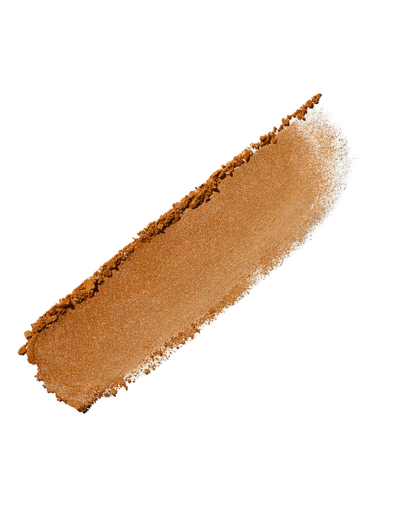 Product smear of Demi'glow Light-Diffusing Highlighter in shade Trophies in Truffle on a white background.