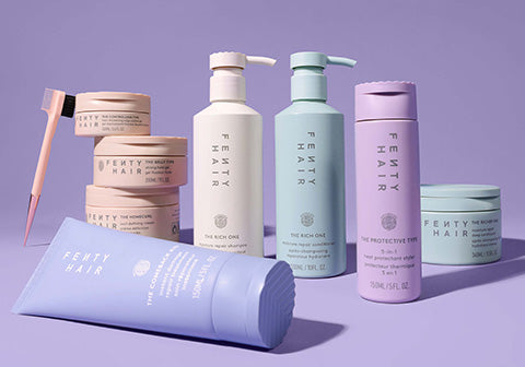 Full assortment of the Fenty Hair product line on a lavender background.