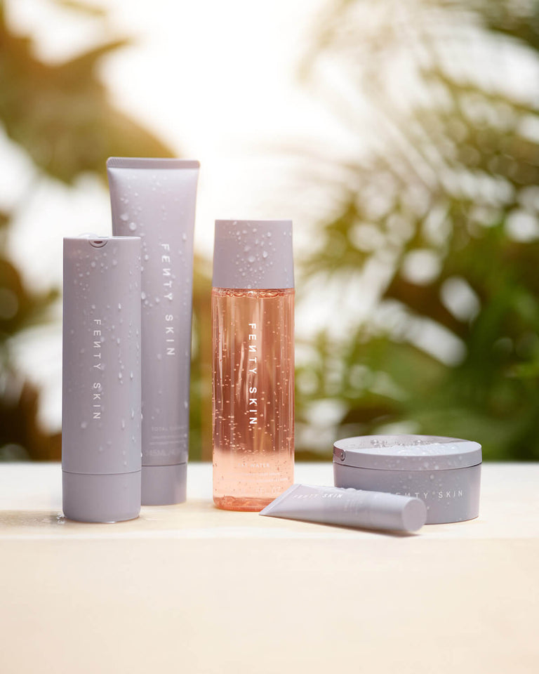 Fenty Skin Start'r Set of five skin care products with tropical background