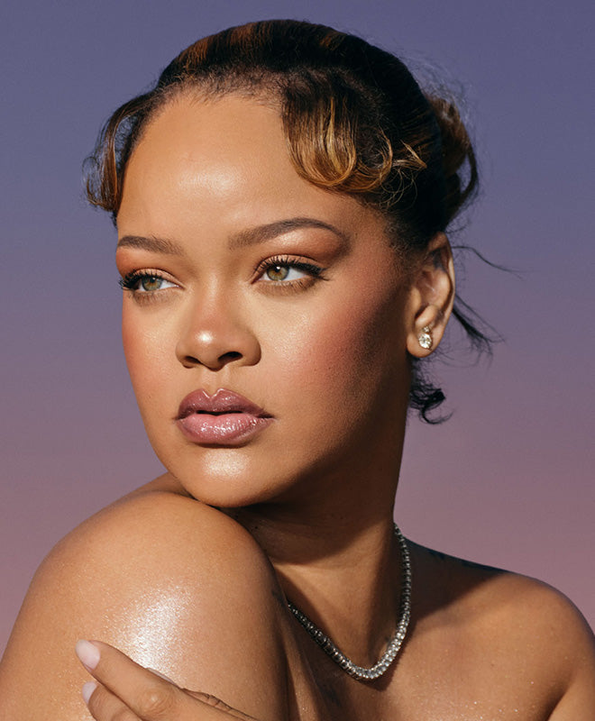 Rihanna Fenty Hair brand image against a gradient purple background.