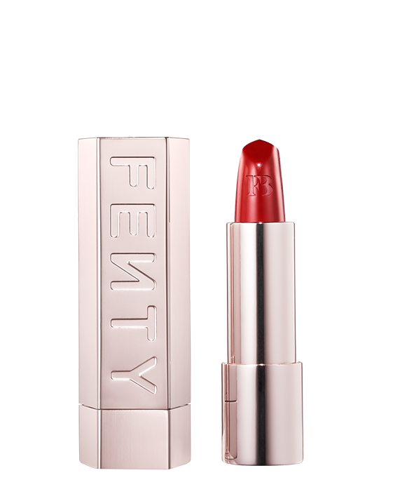 An open Fenty Icon refillable matte lipstick in the high-pigment shade, The MVP. 
