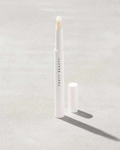 Brow MVP Sculpting Wax Pencil standing upright with the cap off and the brow wax twisted up.