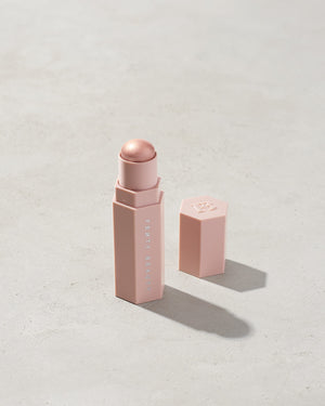 Match Stix Shimmer Skinstick shown in shade Starstruck on a concrete background. 