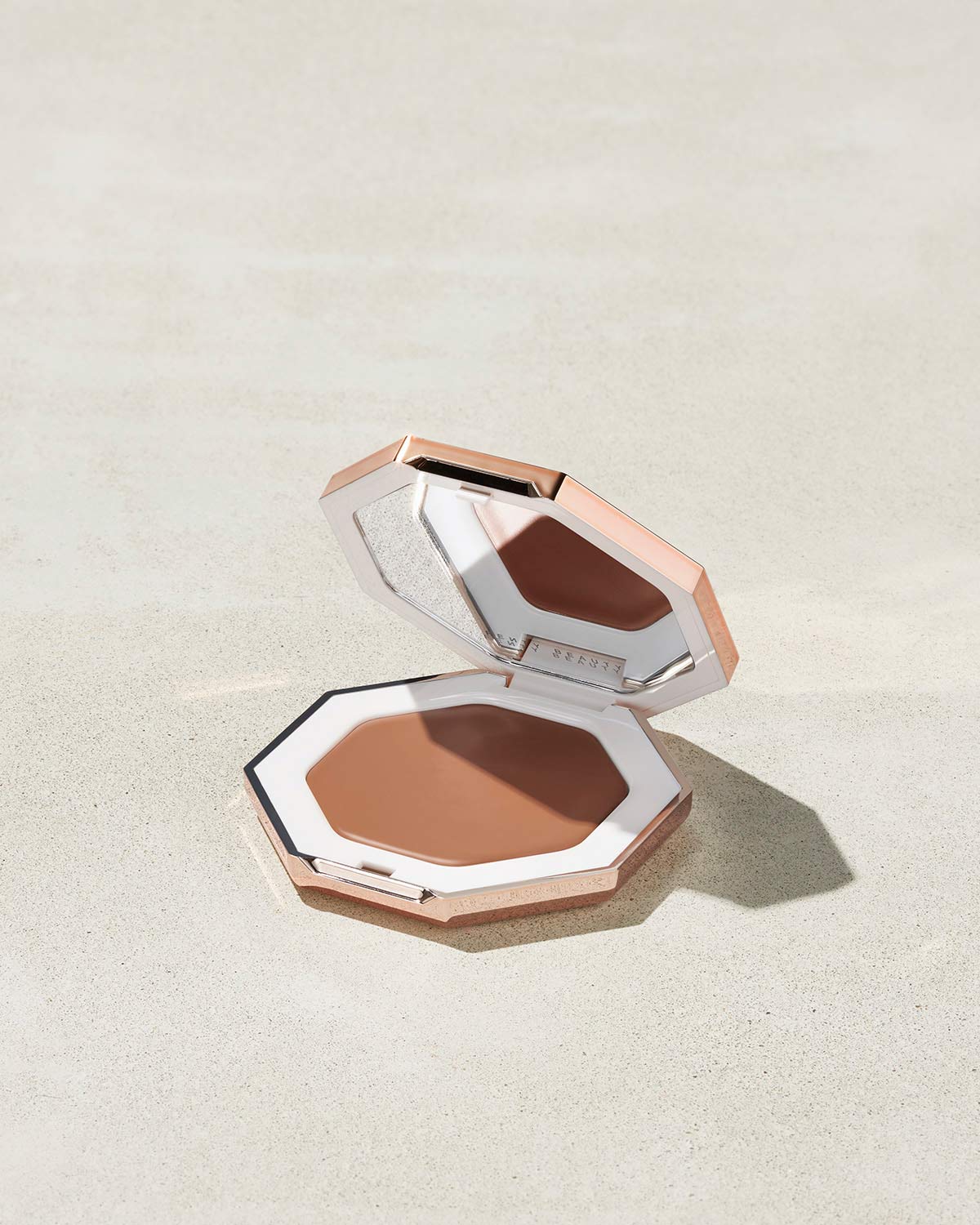 Cheeks Out Freestyle Cream Bronzer shown in shade Macchiato