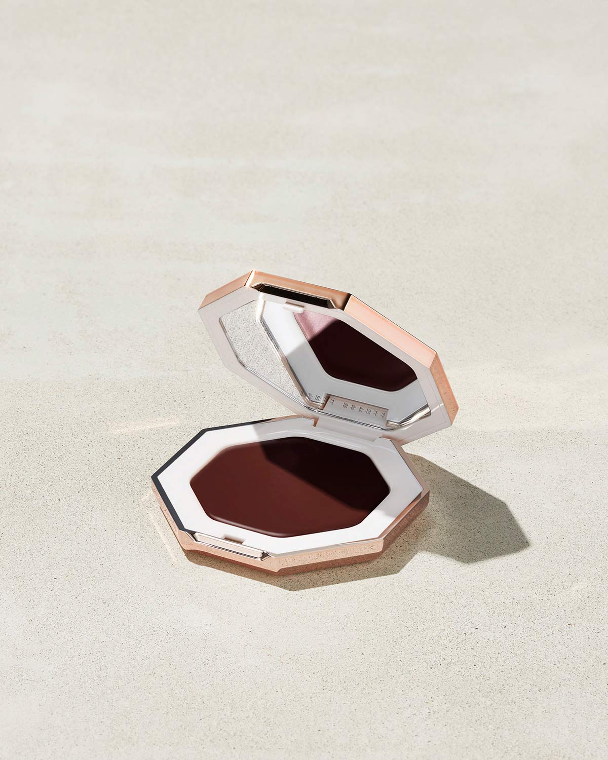 Cheeks Out Freestyle Cream Bronzer shown in shade Toffee Tease