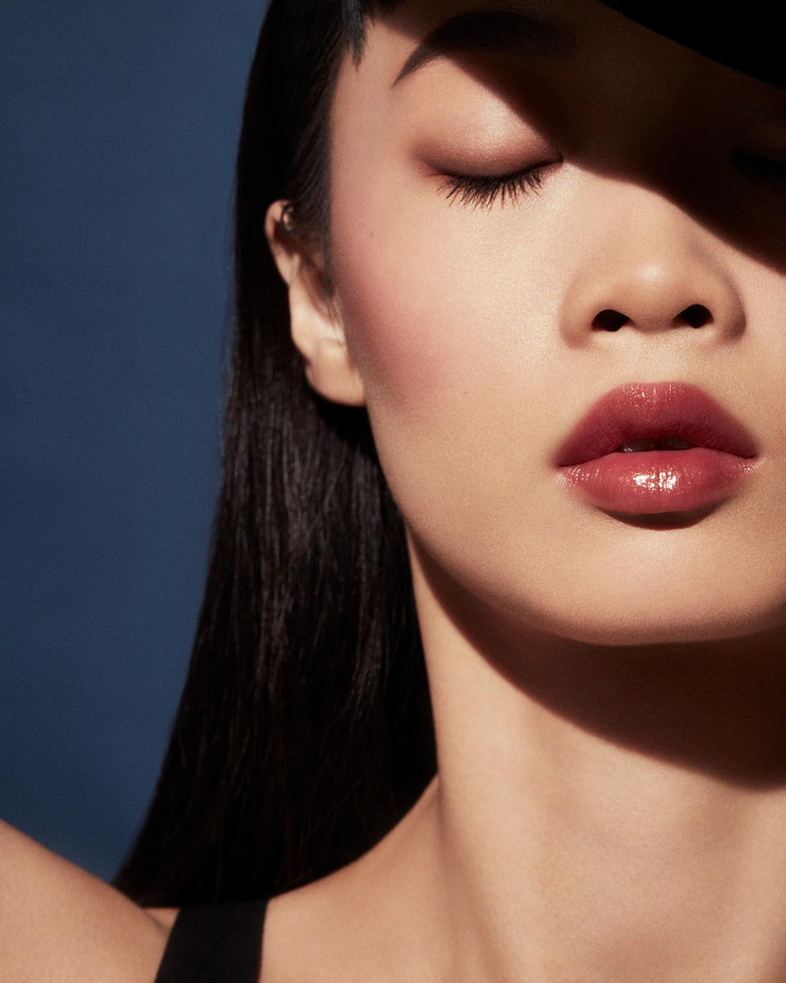 Slip Shine Sheer Shiny Lipstick light model shown in shade Goji Gang