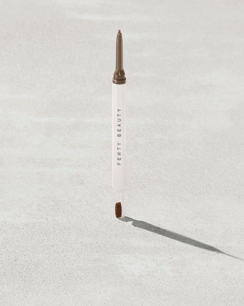 Brow MVP Sculpting Wax Pencil standing upright with the cap off and the brow wax twisted up.