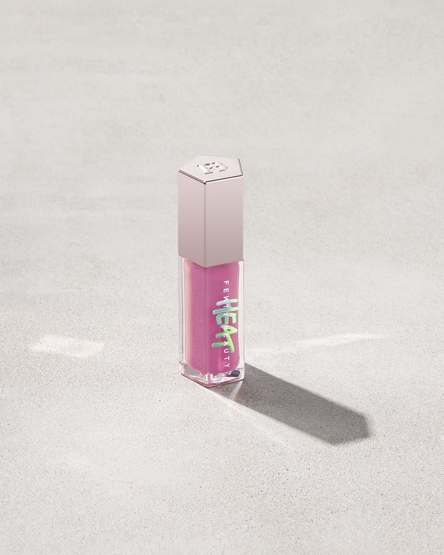 Tube of Fenty Beauty Gloss Bomb Heat Universal Lip Luminizer + Plumper in limited edition shade Lavender Savage made in collaboration with Savage X Fenty.
