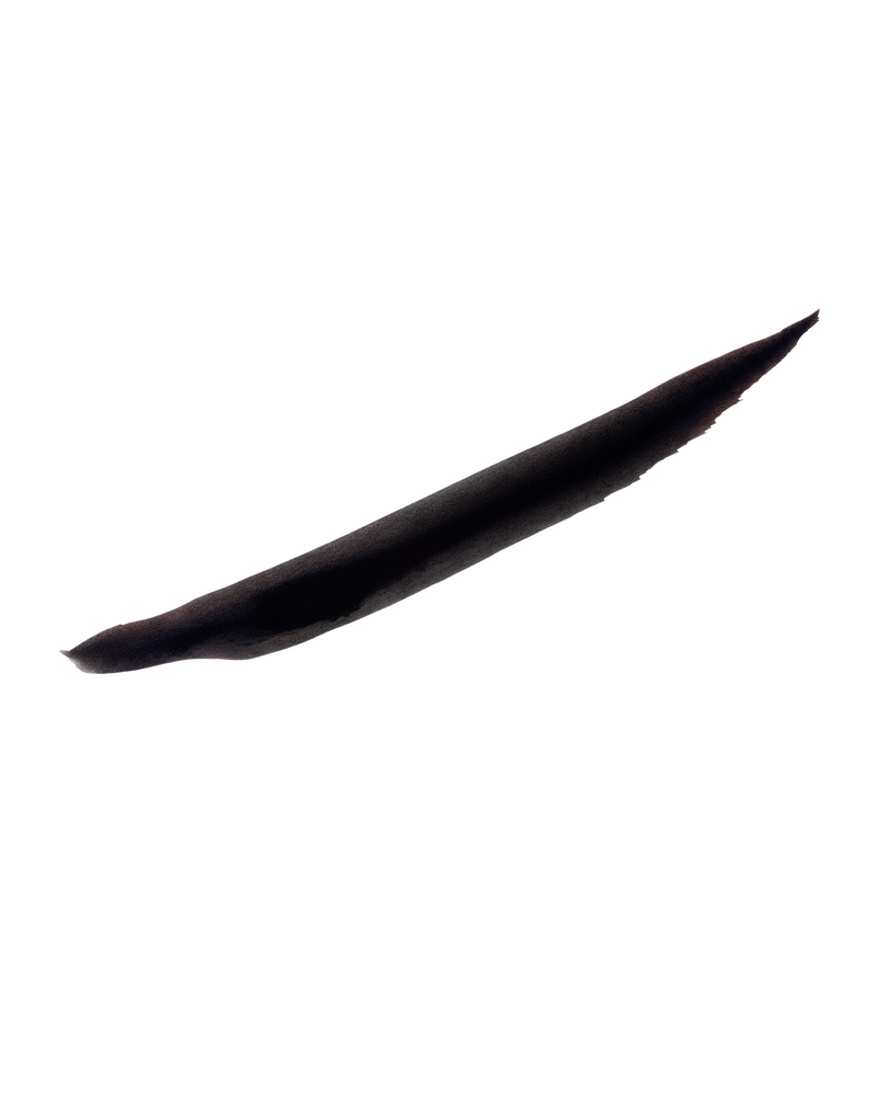 A thick swatch of Flyliner Longwear Liquid Eyeliner in the color "Cuz I'm Black", showcasing its satin black finish, boldly contrasted against a pristine white background.